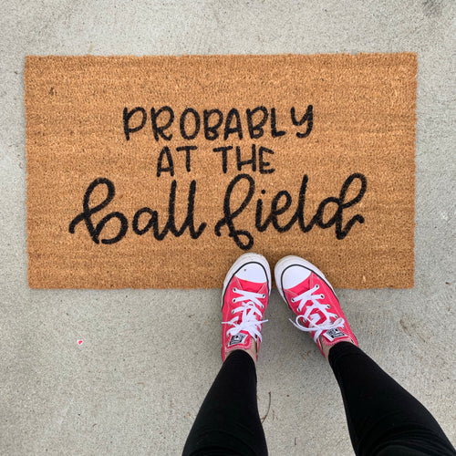 Probably at the ball field doormat